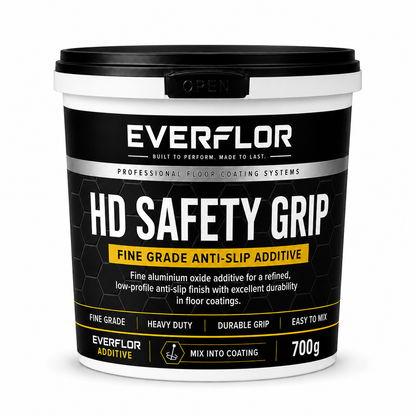 A 700g bucket of Everflor HD Safety Grip fine grade anti-slip additive, featuring a black and white label with yellow accents, on a white background.